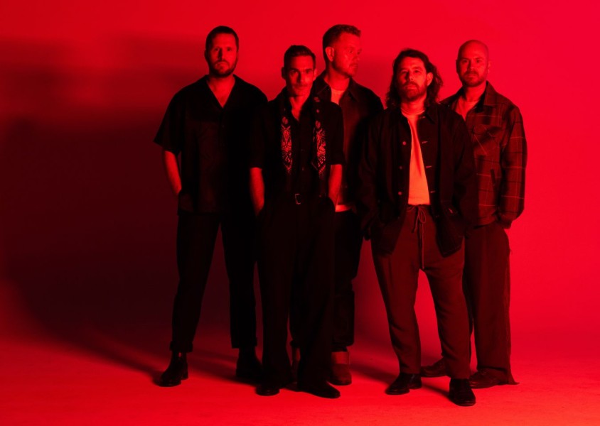 Red hued image of the band Boy & bearx